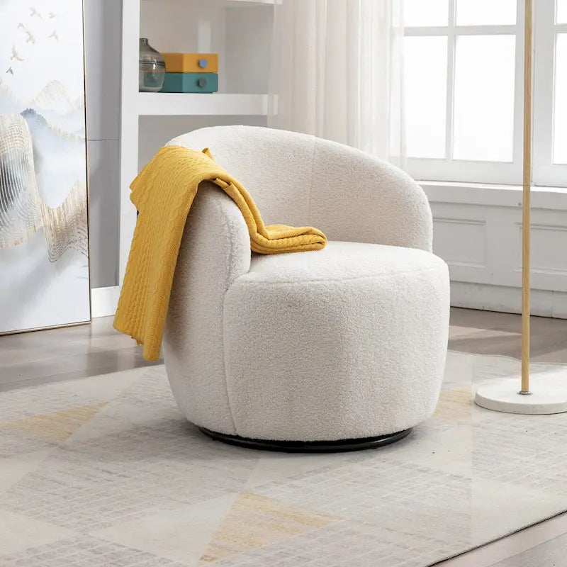 Fauteuil pivotant d'appoint en tissu Teddy, fauteuil club rembourré avec piètement pivotant rond en métal noir.