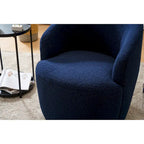 Fauteuil pivotant d'appoint en tissu Teddy, fauteuil club rembourré avec piètement pivotant rond en métal noir.